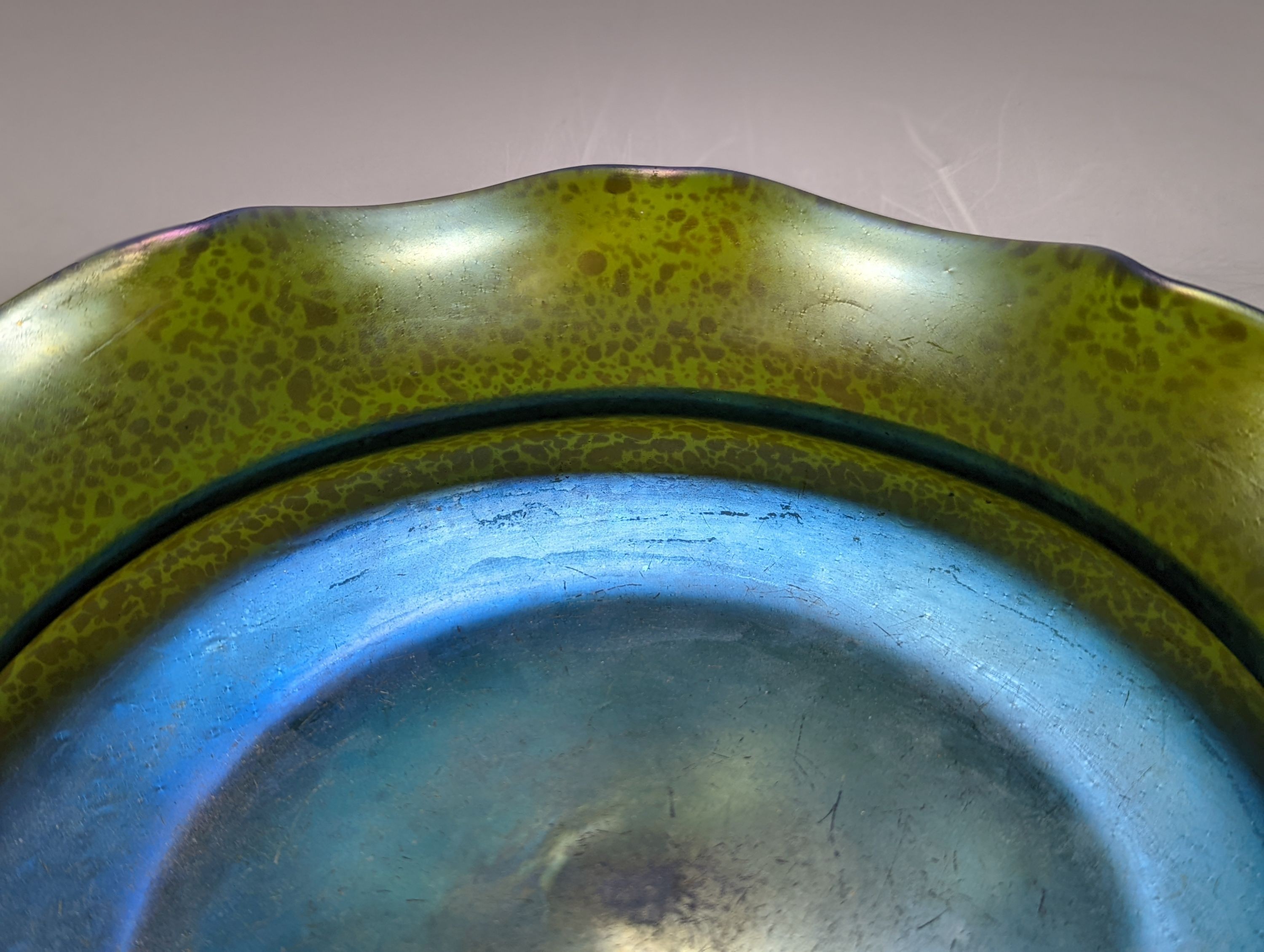 An Austrian iridescent glass bowl, probably Loetz, c.1910, diam. 26.5cm